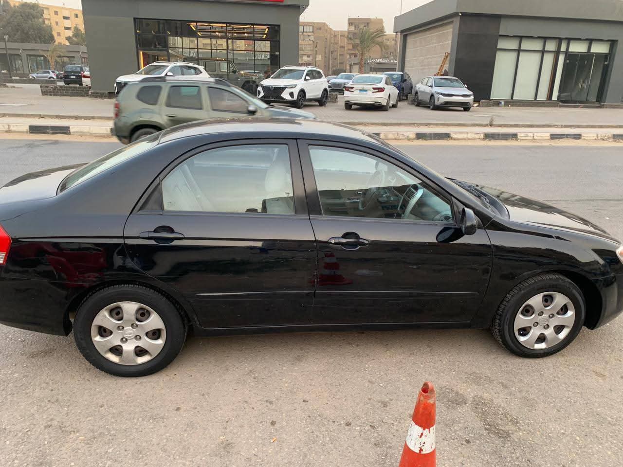 كيا سيراتو موديل 2009 اتوماتيك جولد  فابريكة بالكامل عدا داير رفرف وباب